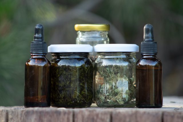 Alcohol/cannabis liquor bottles and droppers. The darker bottle contains an extract made from the buds and leaves; the lightest, with clean buds